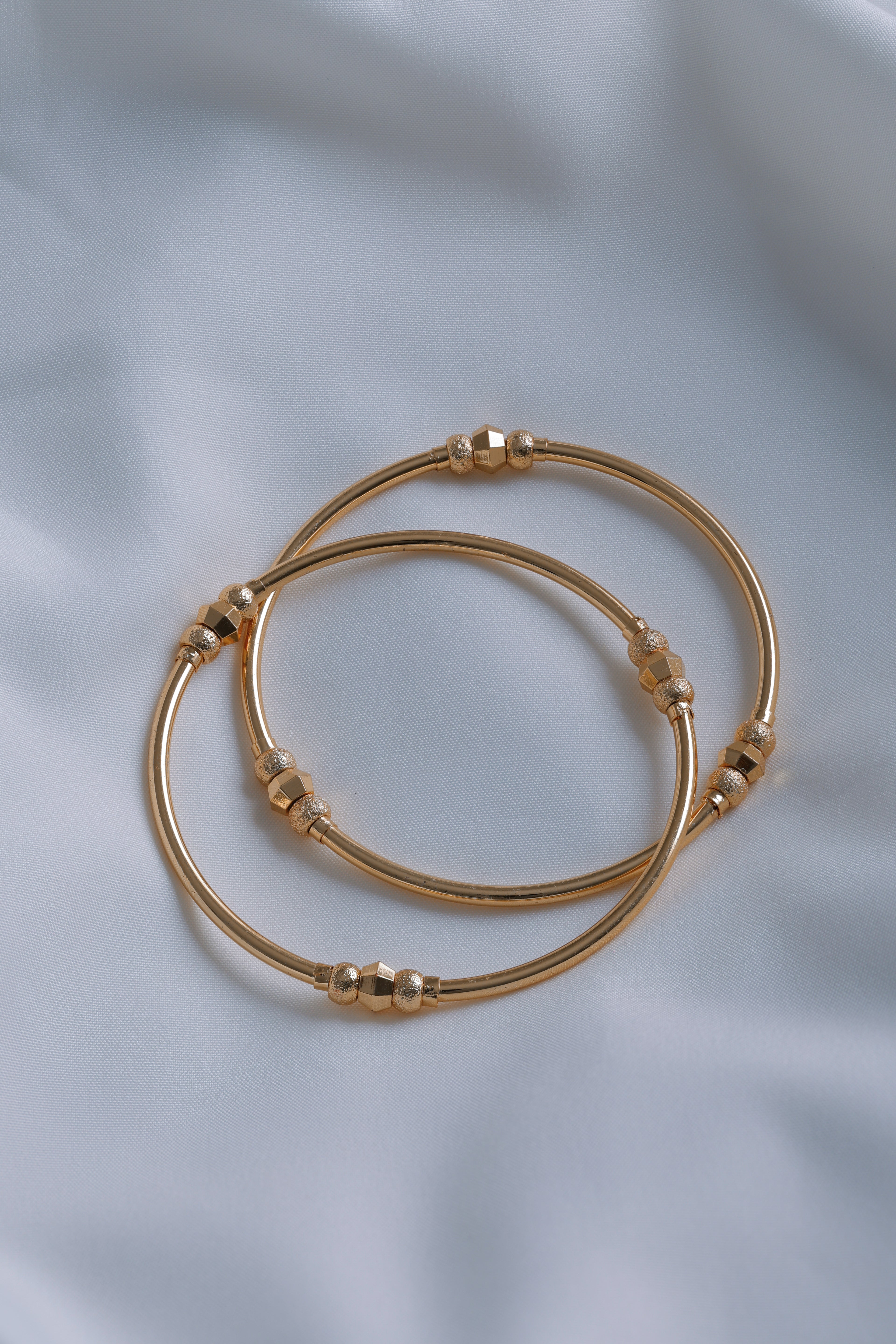 Timeless Radiance: Gold-Plated Slim Beaded Bangles (Set of 2)