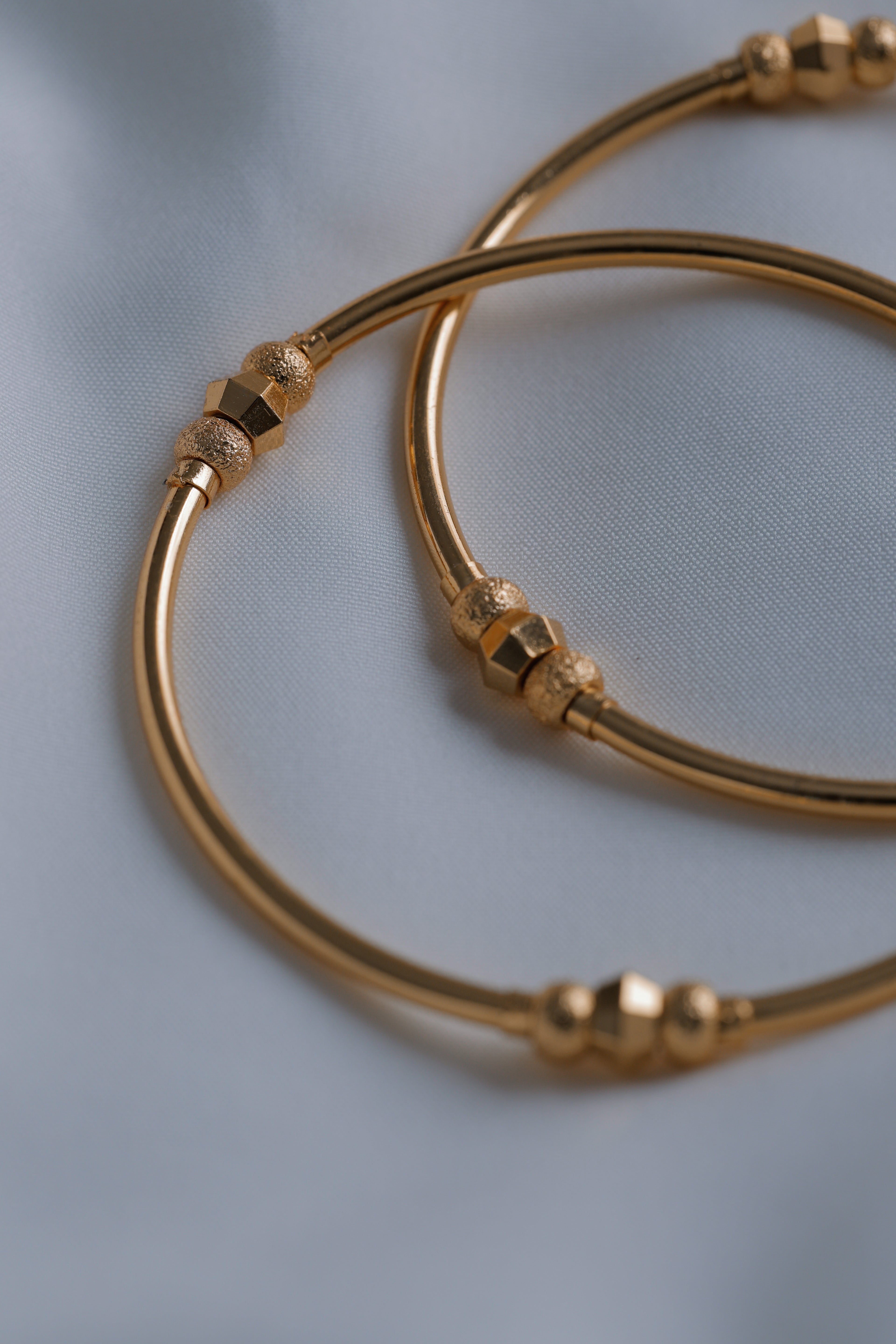 Timeless Radiance: Gold-Plated Slim Beaded Bangles (Set of 2)