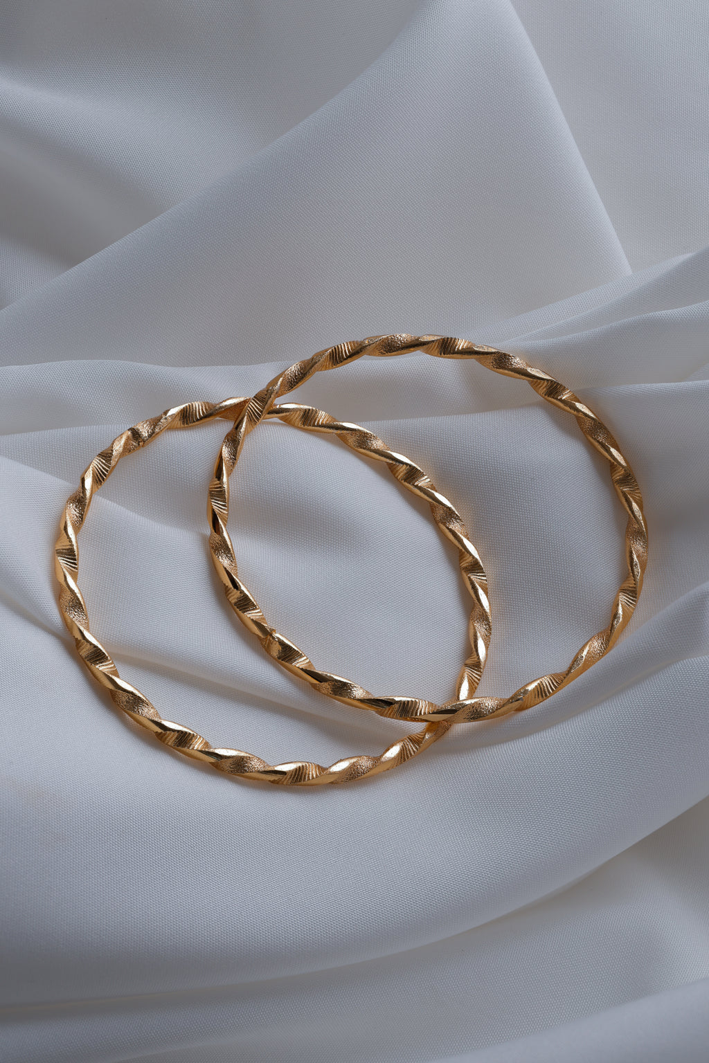 Elegant Twisted Ribbon Gold-Plated Bangles (Set of 2)
