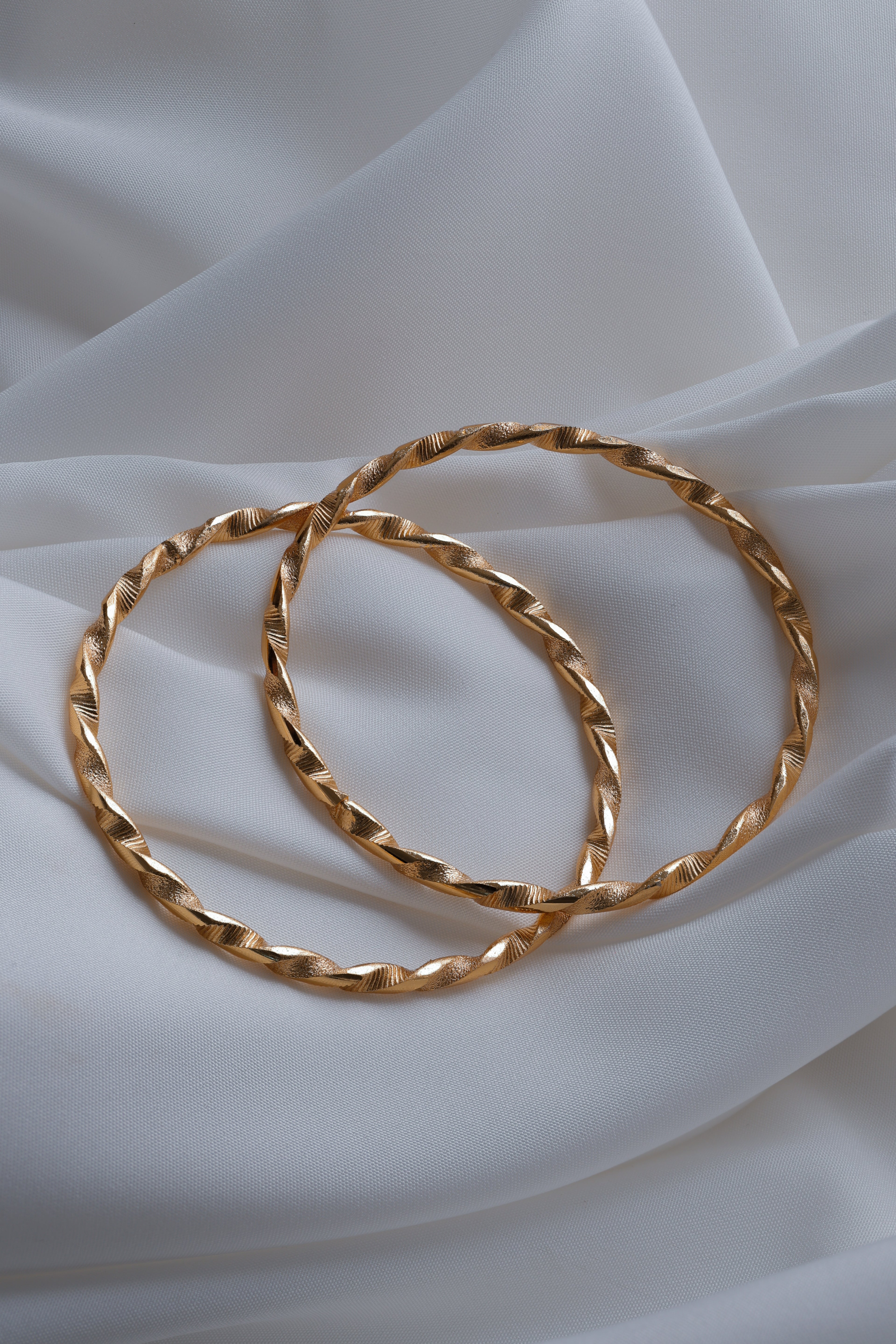 Elegant Twisted Ribbon Gold-Plated Bangles (Set of 2)