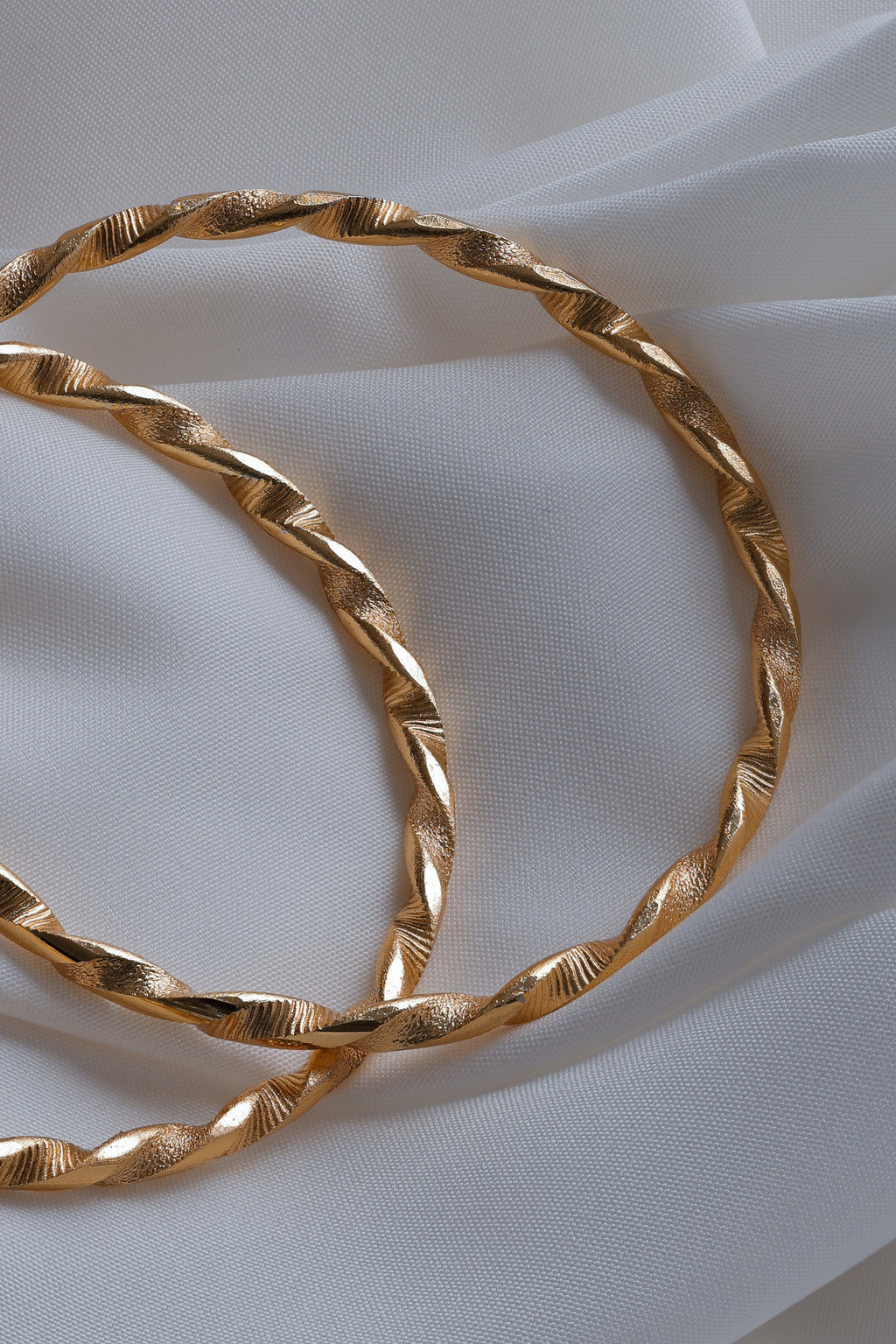 Elegant Twisted Ribbon Gold-Plated Bangles (Set of 2)