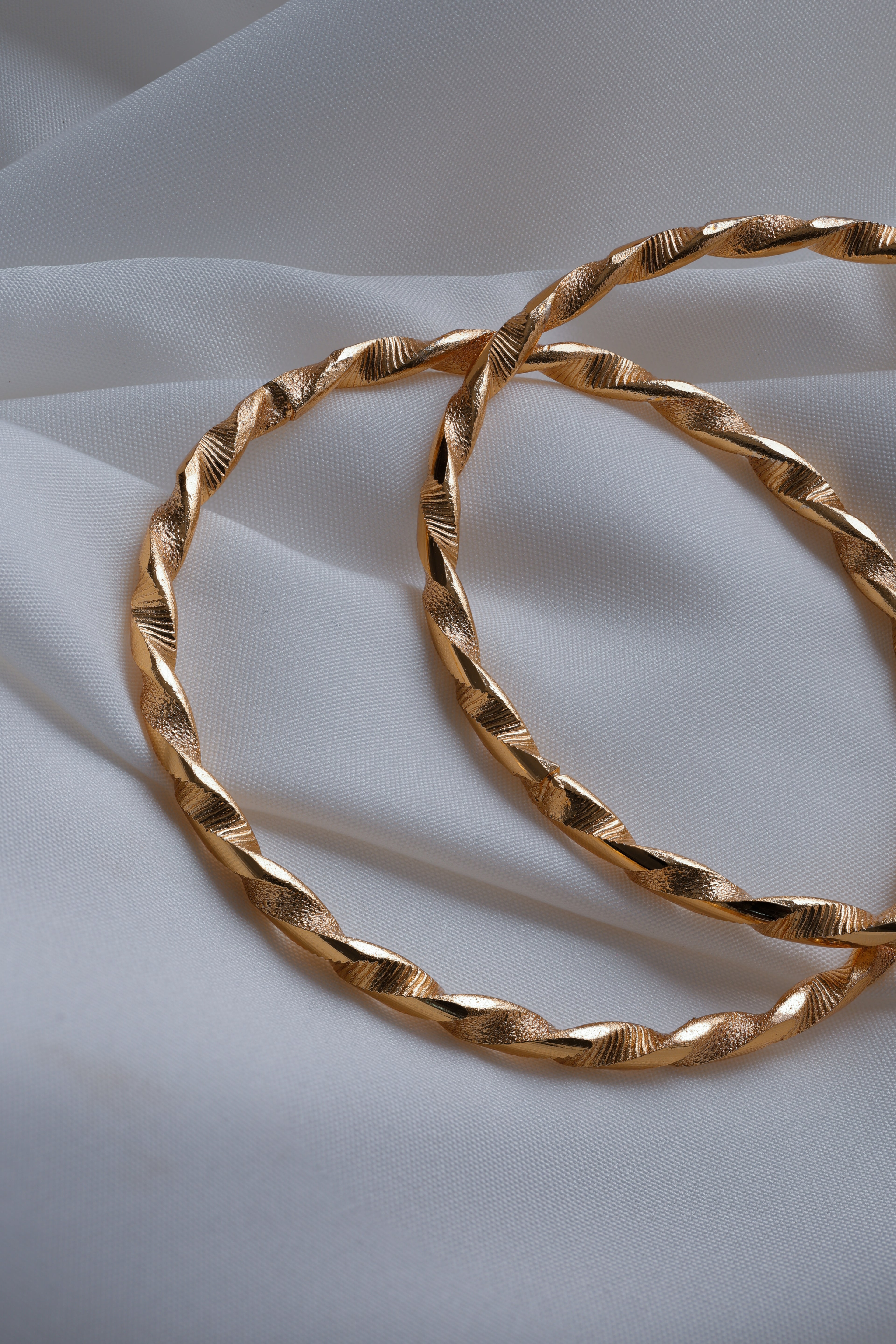 Elegant Twisted Ribbon Gold-Plated Bangles (Set of 2)