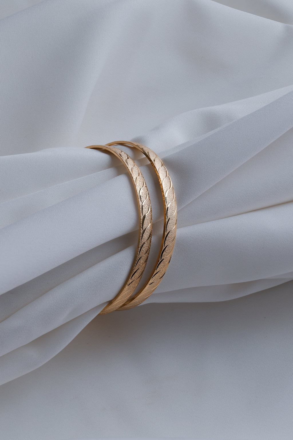 Gold-Toned Waves of Elegance: Dual-Texture Precision- Etched Bangles ( Set of 2)