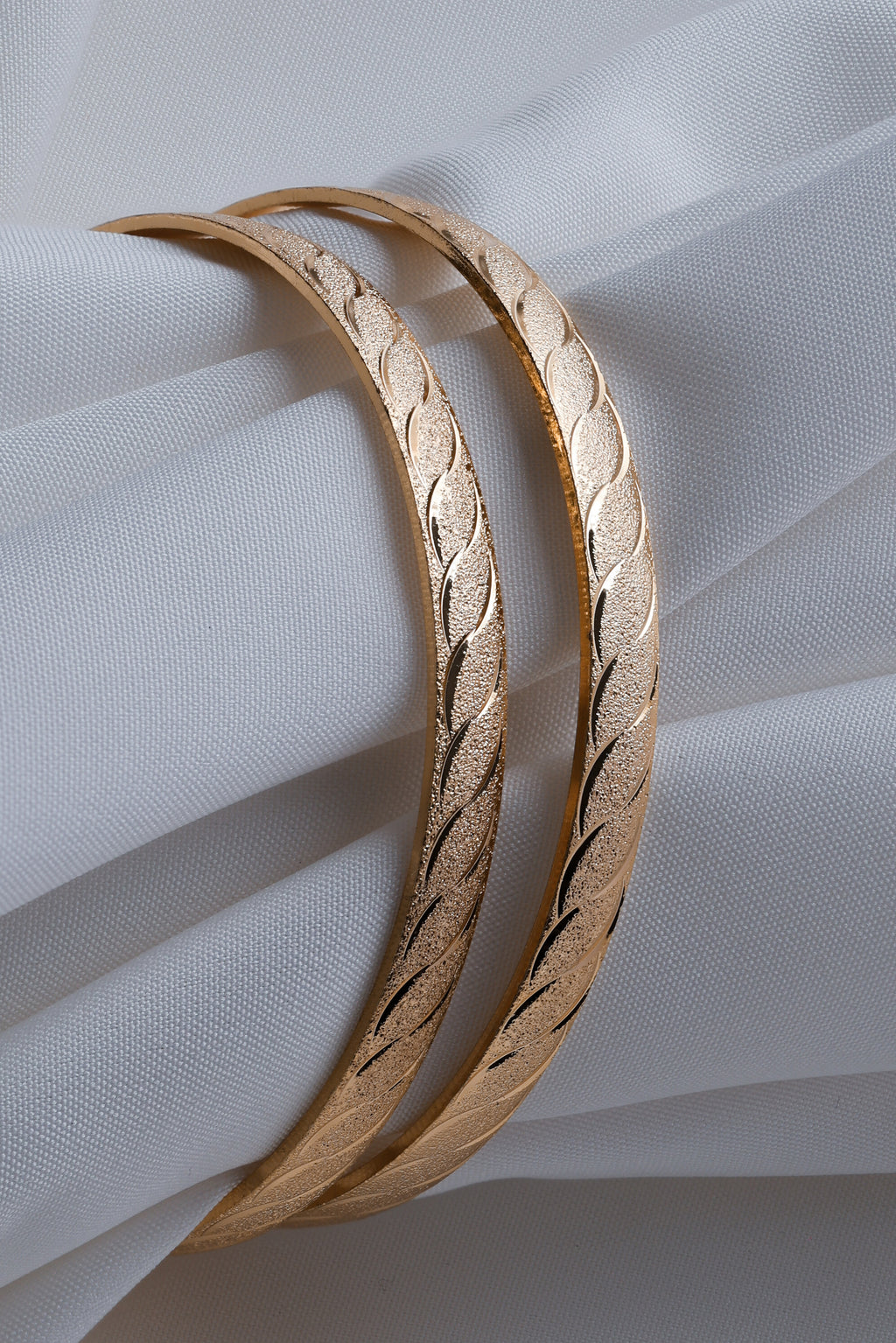 Gold-Toned Waves of Elegance: Dual-Texture Precision- Etched Bangles ( Set of 2)