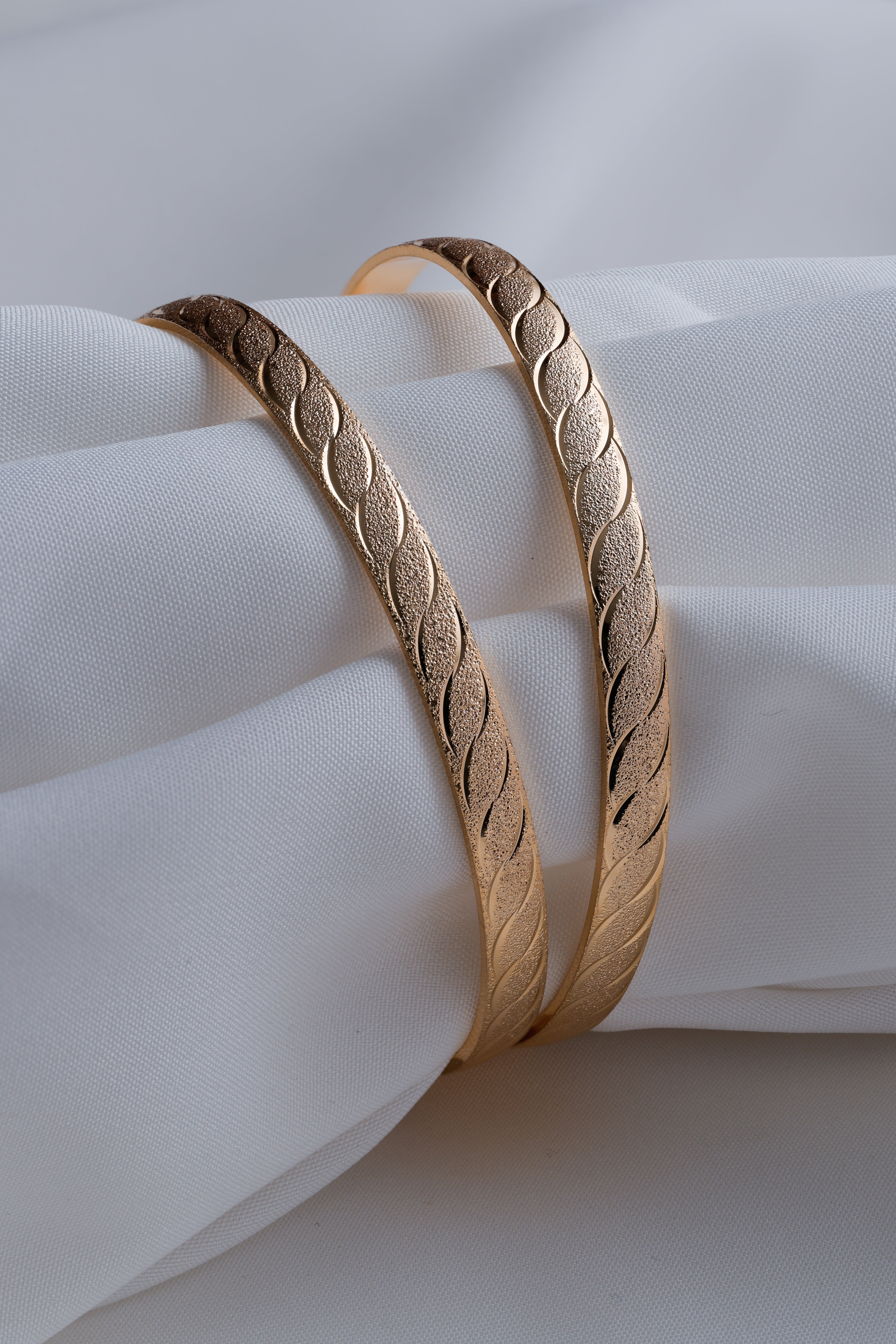 Gold-Toned Waves of Elegance: Dual-Texture Precision- Etched Bangles ( Set of 2)